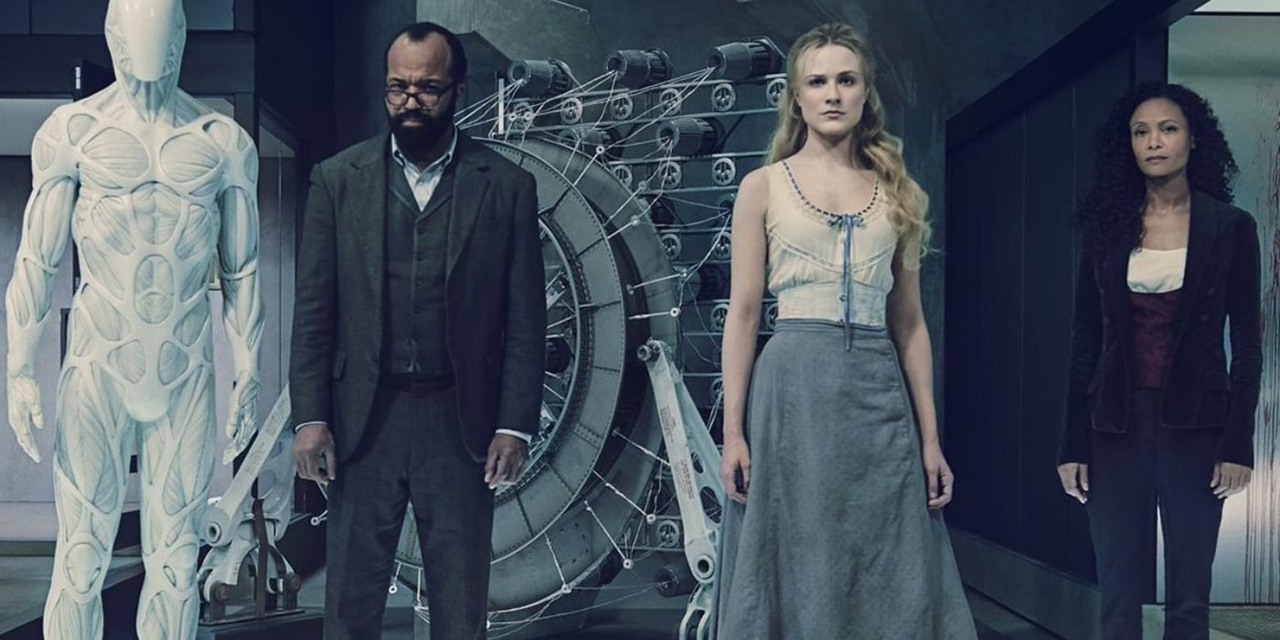 The cast of Westworld stand together in a promotional photo with a futuristic background.