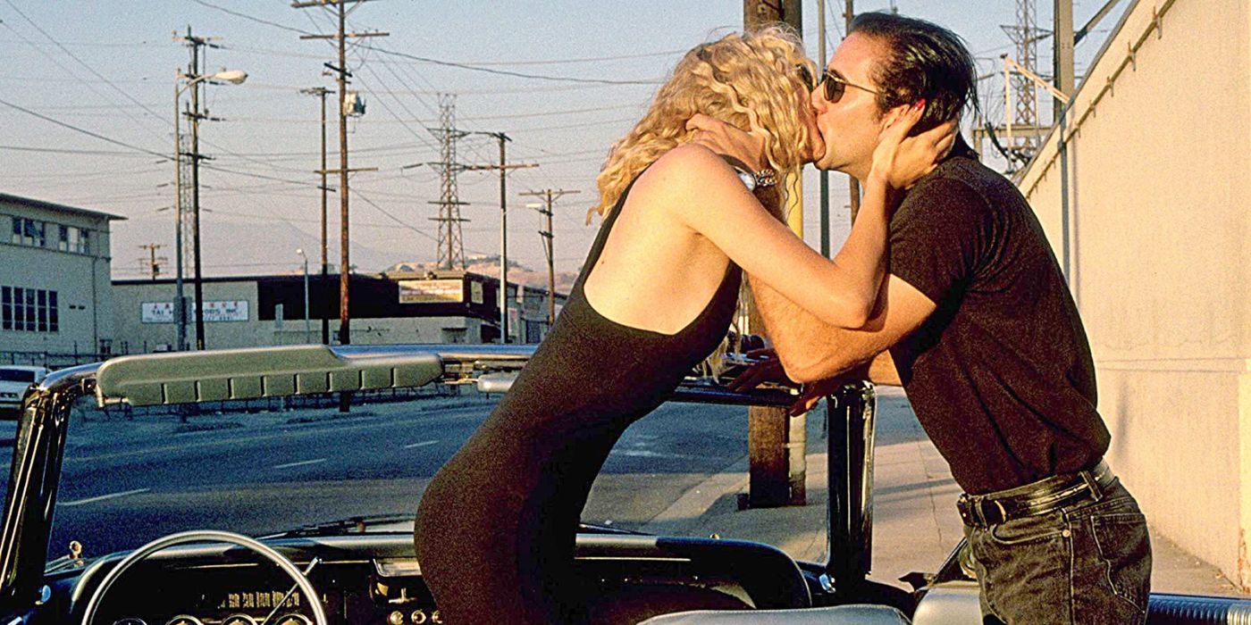Nicolas Cage and Laura Dern passionately kissing in Wild at Heart