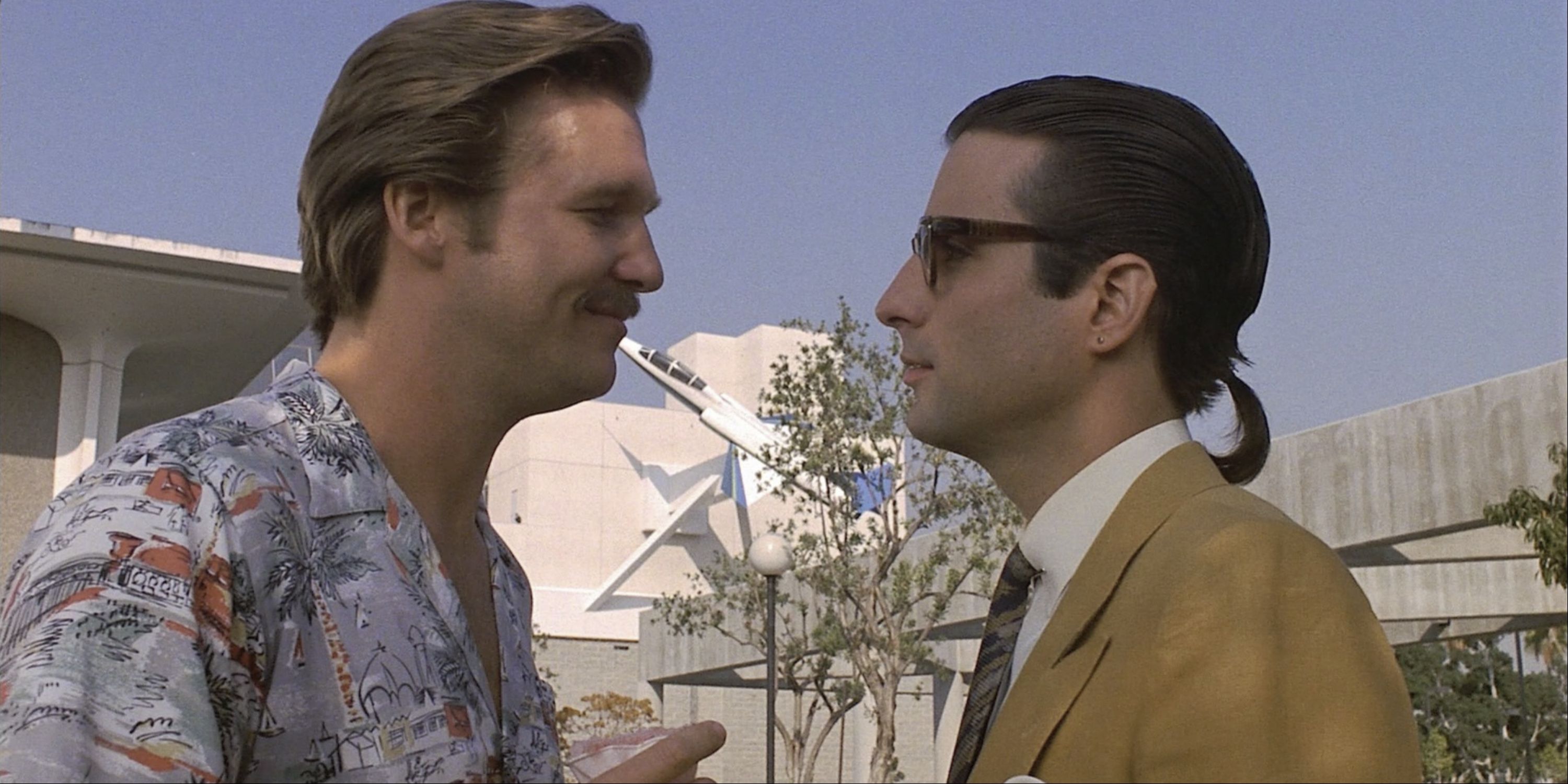 Jeff Bridges and Andy Garcia looking at each other in 8 Million Ways to Die