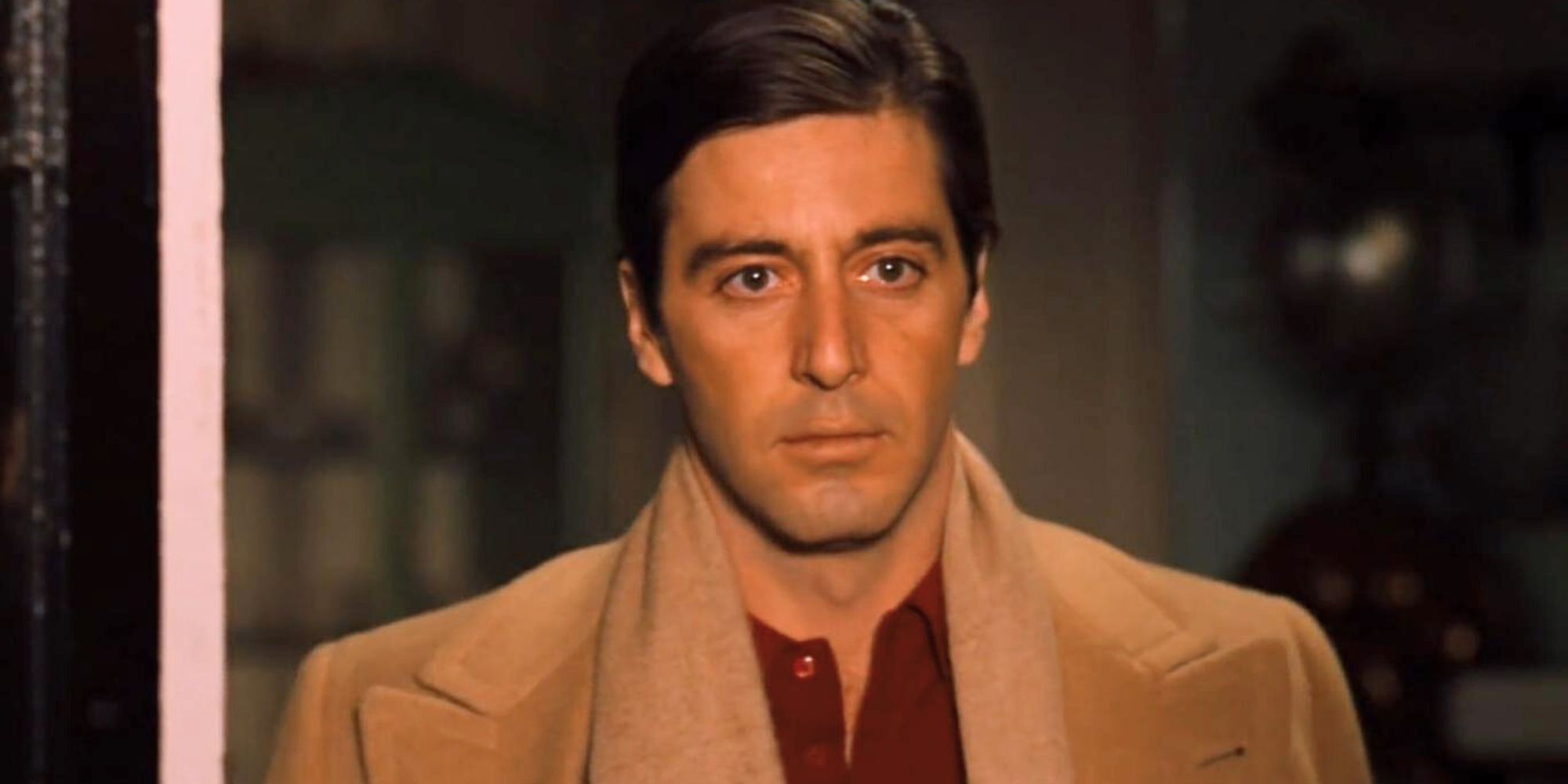 Al Pacino looking out a window in The Godfather: Part II (1974)