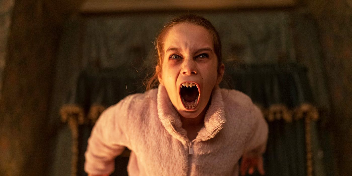 Alisha Weir bearing her vampire teeth in Abigail