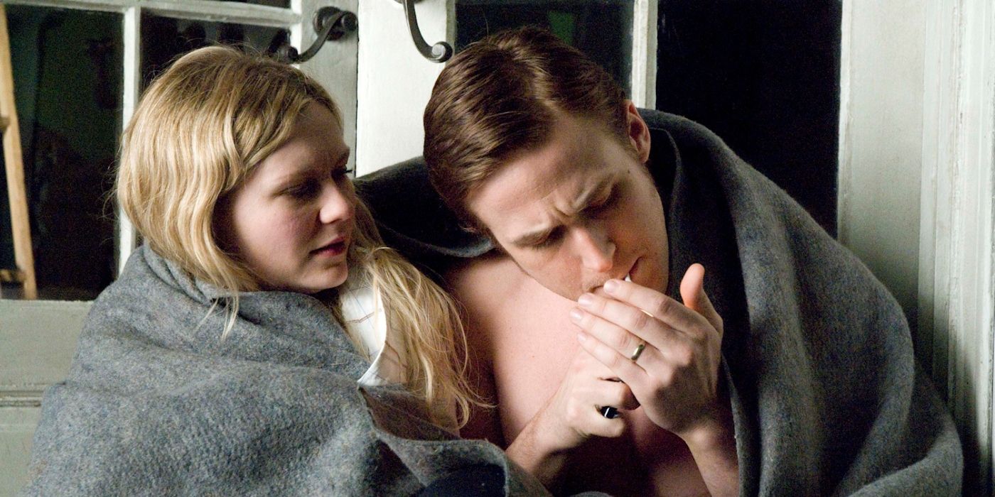 Ryan Gosling and Kirsten Dunst as David Marks and Katherine McCarthy, sitting wrapped in a blanket while David lights a cigarette in All Good Things