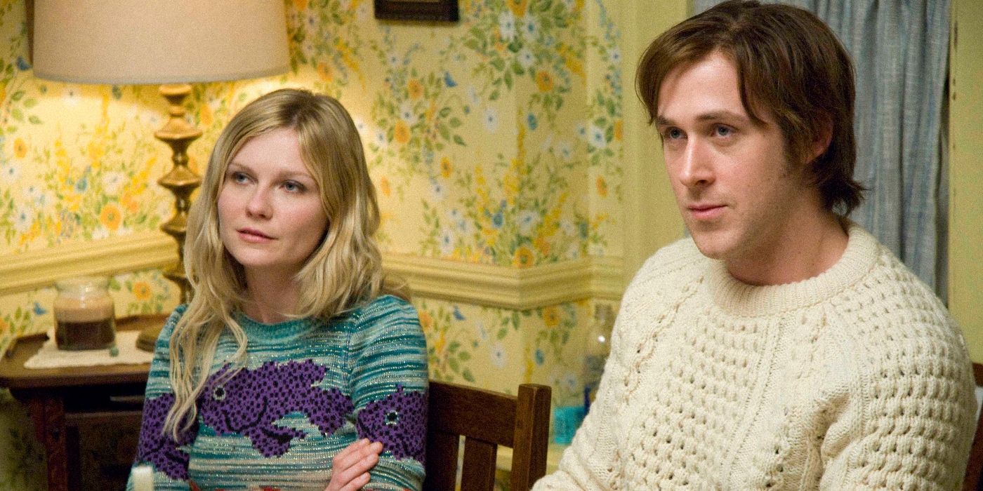 Ryan Gosling and Kirsten Dunst as David Marks and Katherine McCarthy, sitting at a dinner table and looking at someone offscreen in All Good Things