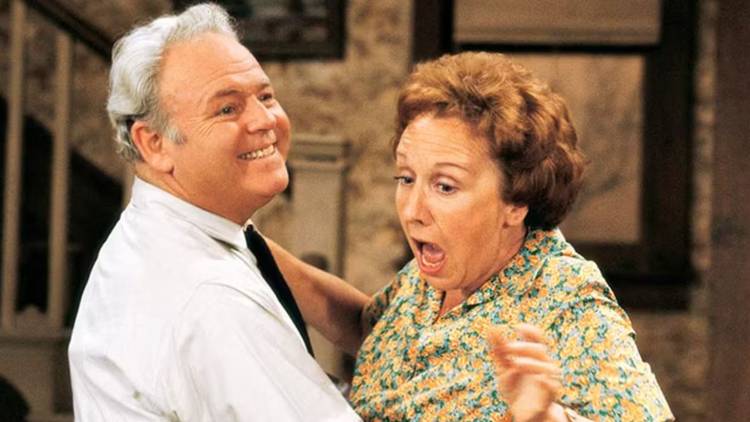 Archie and Edith Bunker embracing in All in the Family