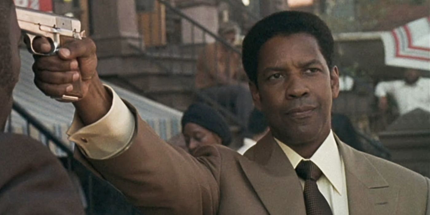 Denzel Washington as Frank Lucas, pointing a gun in American Gangster