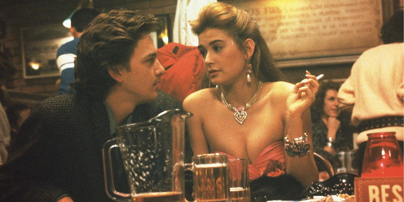 Andrew McCarthy and Demi Moore having a conversation in a bar in St. Elmo's Fire
