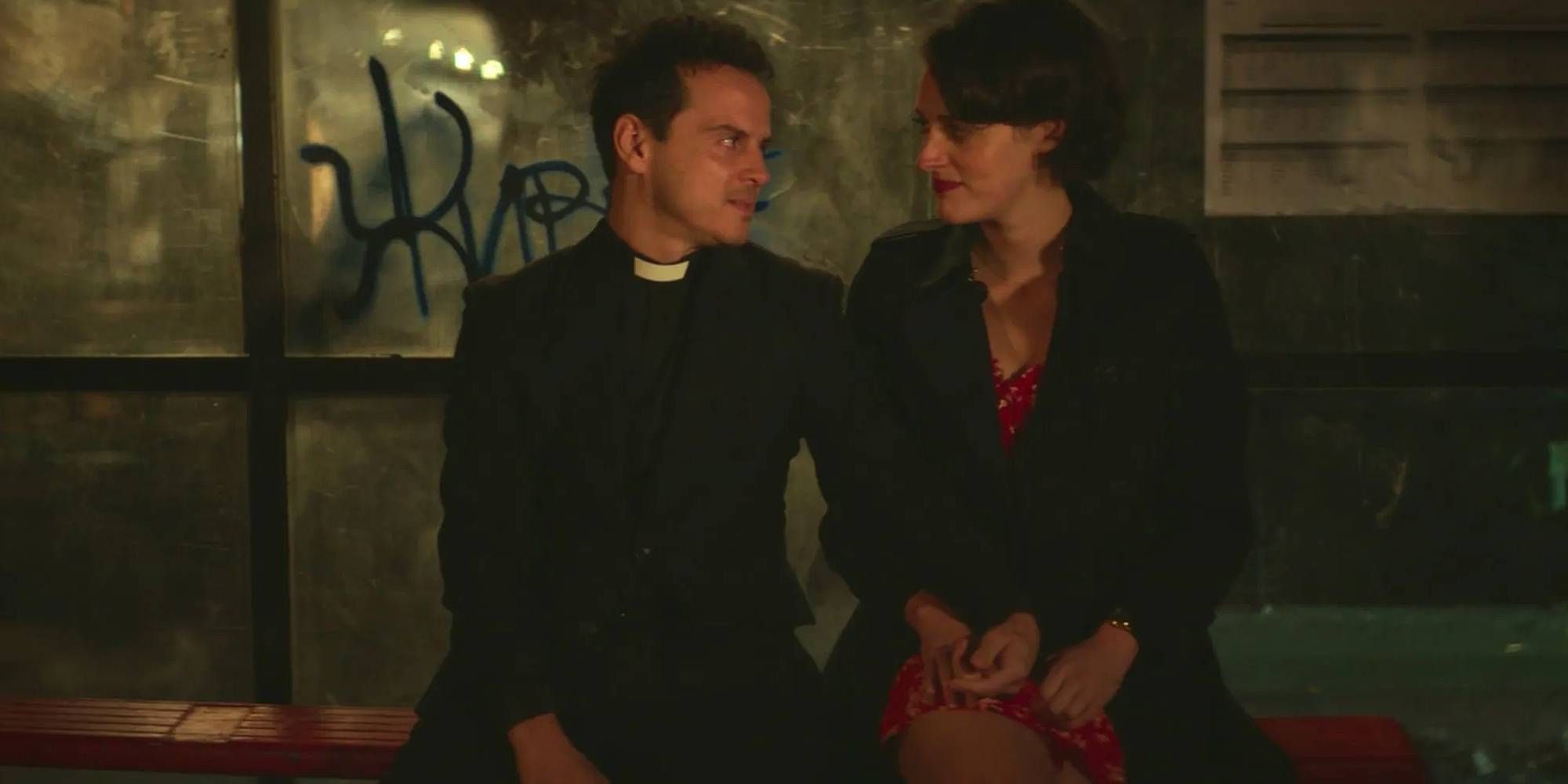The Priest and Fleabag in Fleabag sitting next to each other on a bus stop and touching hands.