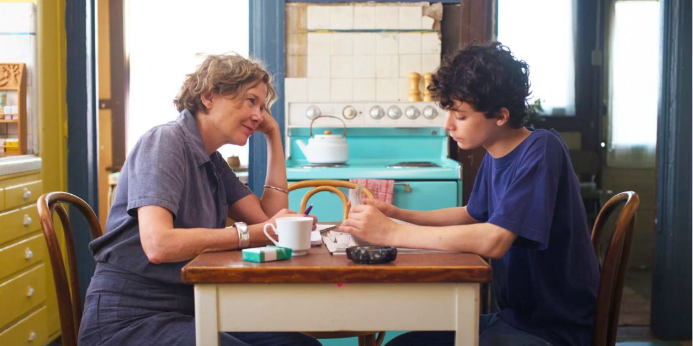 Dorothea talks with her son while sitting in a kitchen table in 20th Century Women.