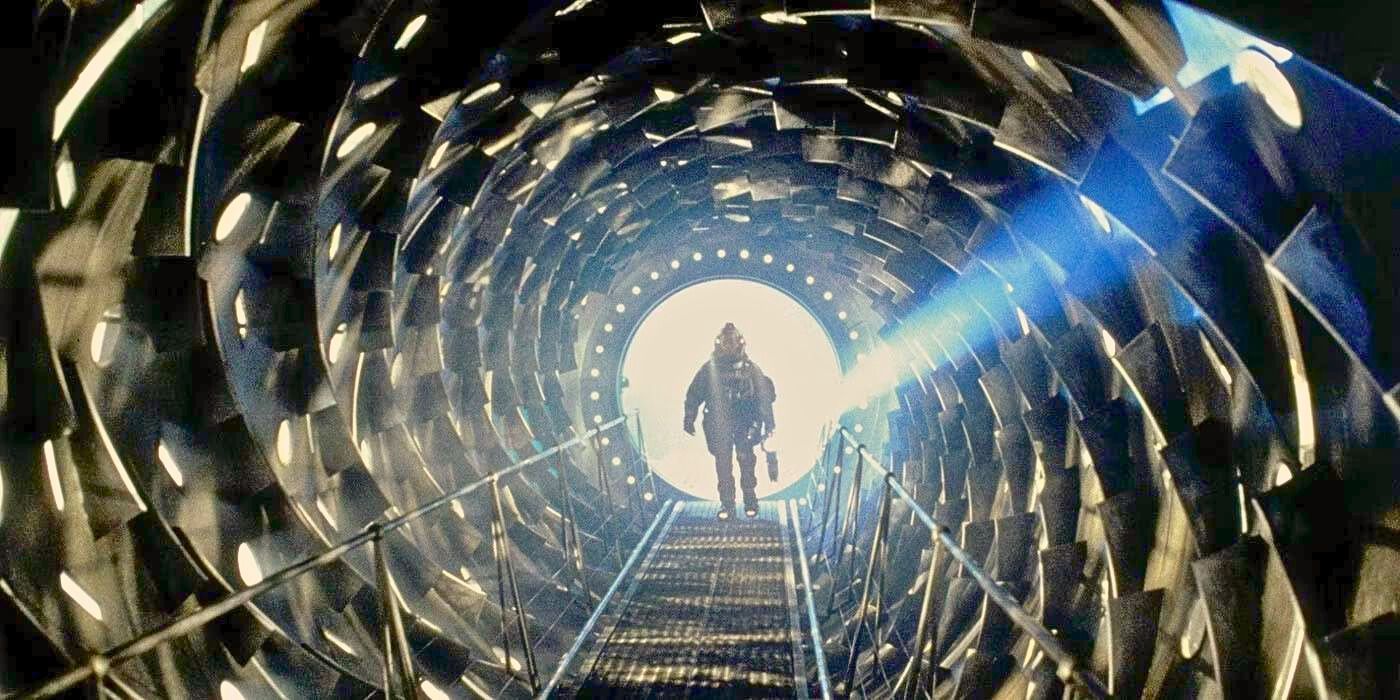 Astronaut enters the Event Horizon spaceship through a toothy tunnel in Event Horizon.