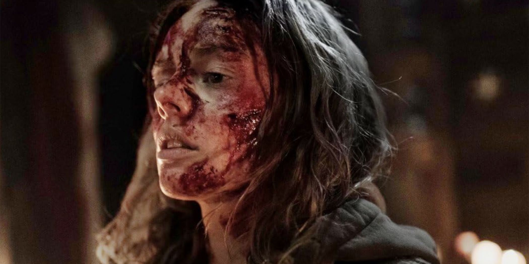 A close-up of Samara Weaving covered in blood