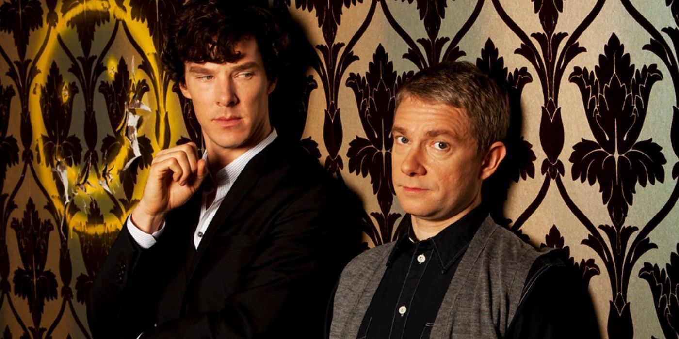 Benedict Cumberbatch & Martin Freeman as Sherlock & Watson pose against a wall for Sherlock