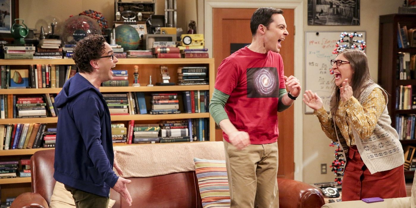 Leonard (Johnny Galecki), Sheldon (Jim Parsons), and Amy (Mayim Bialik) cheering in excitement in The Big Bang Theory