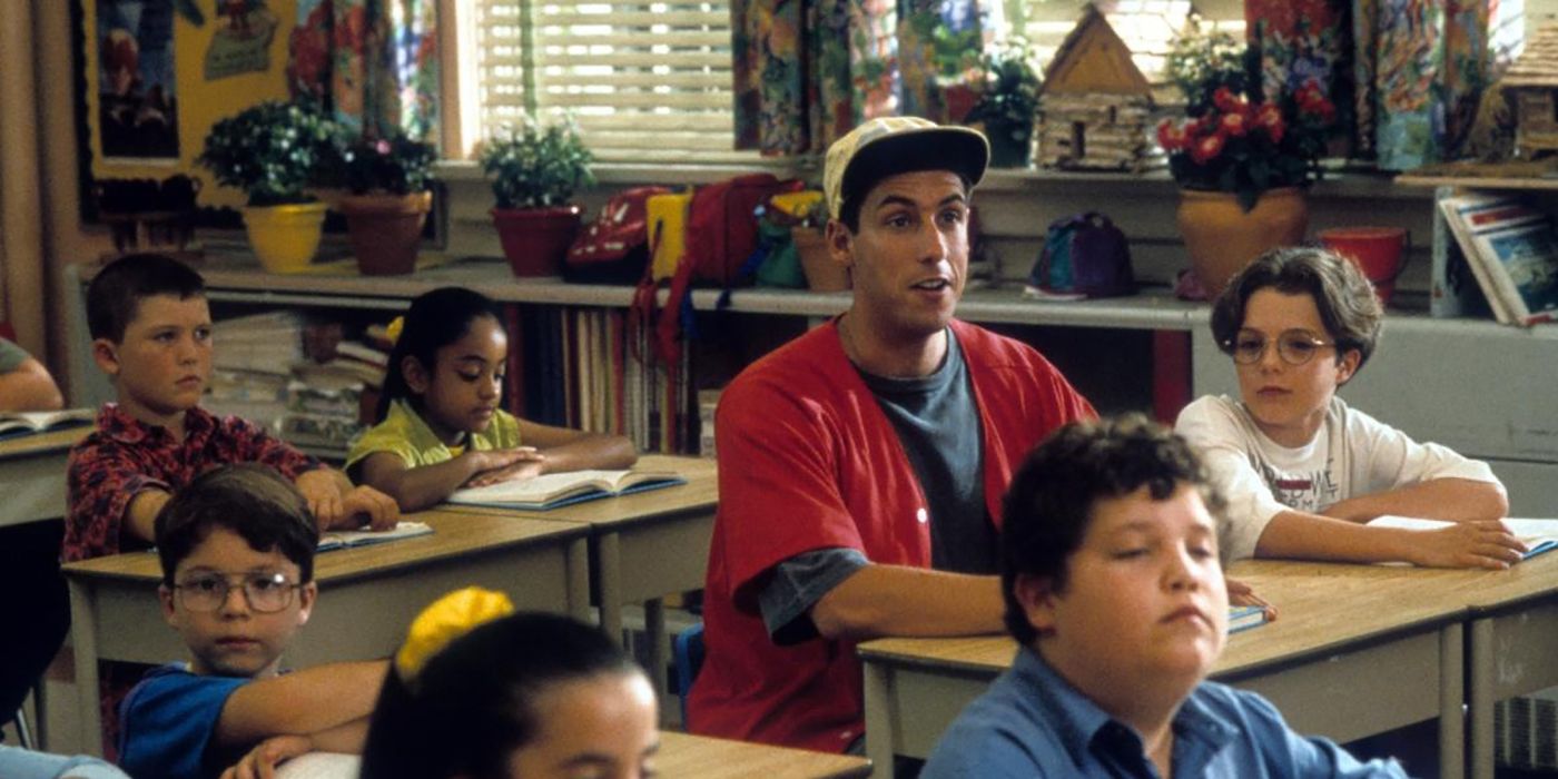 Billy sitting too attention in the classroom surrounded by smaller kids in Billy Madison