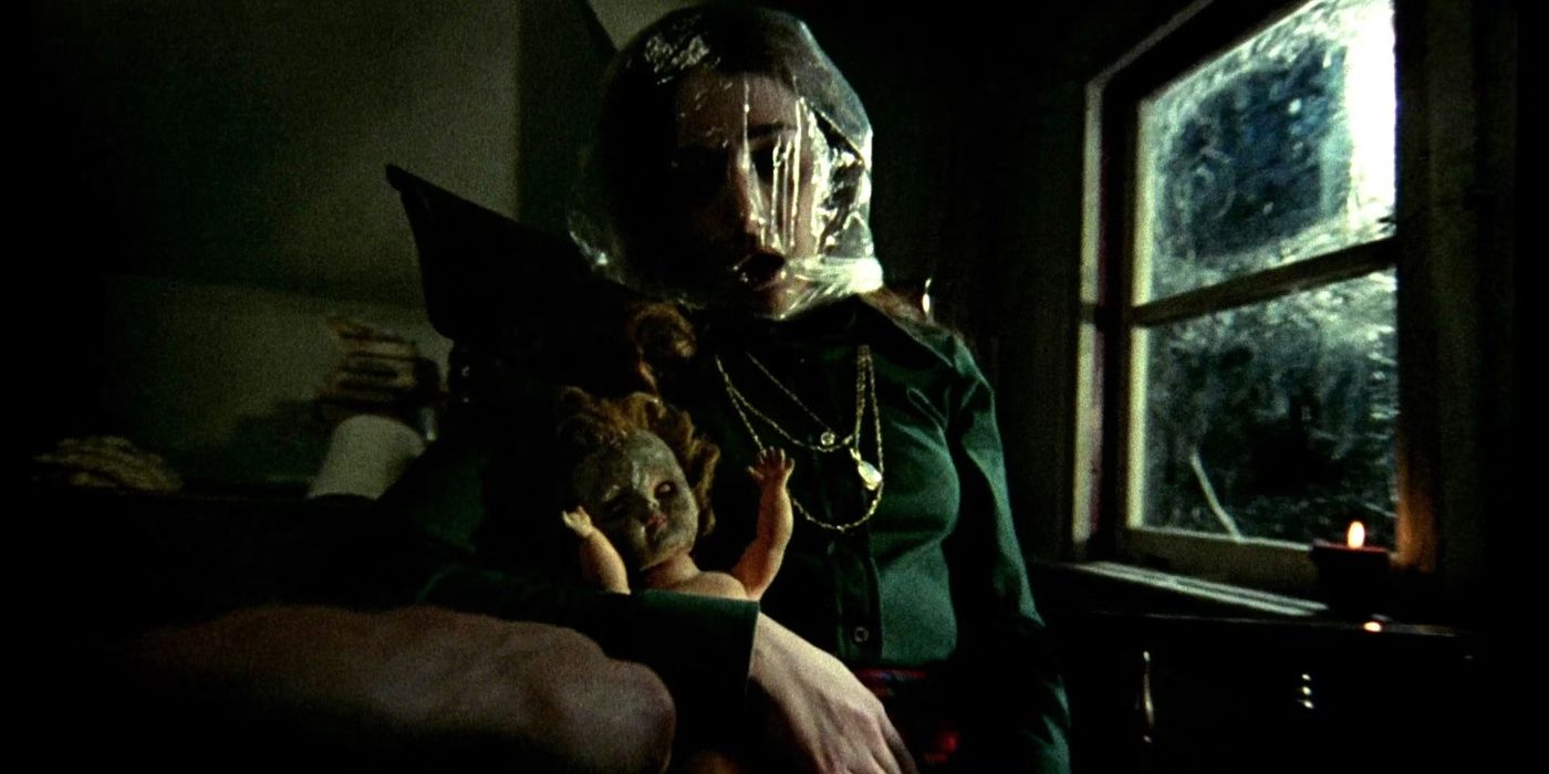 A young woman with a plastic bag around her head in Black Christmas