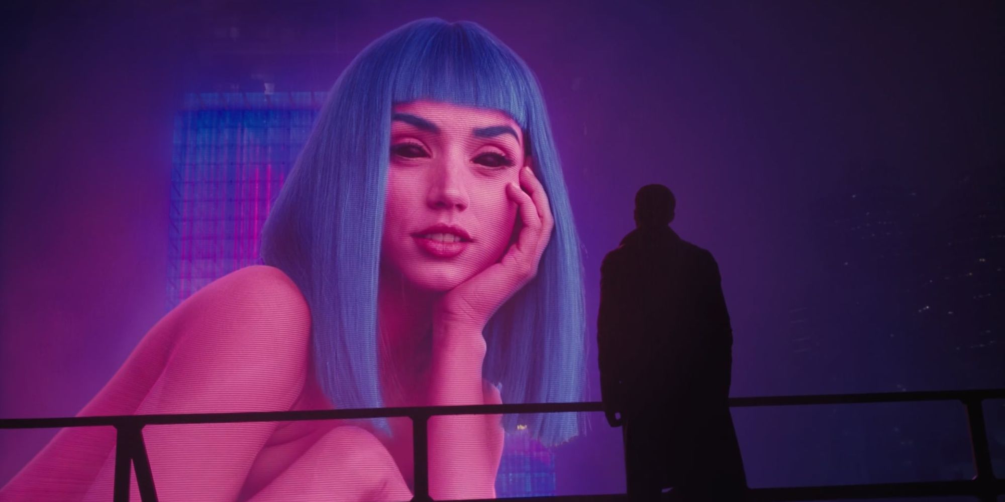 A giant hologram of Joi, looking at Ryan Gosling as K in 'Blade Runner 2049'