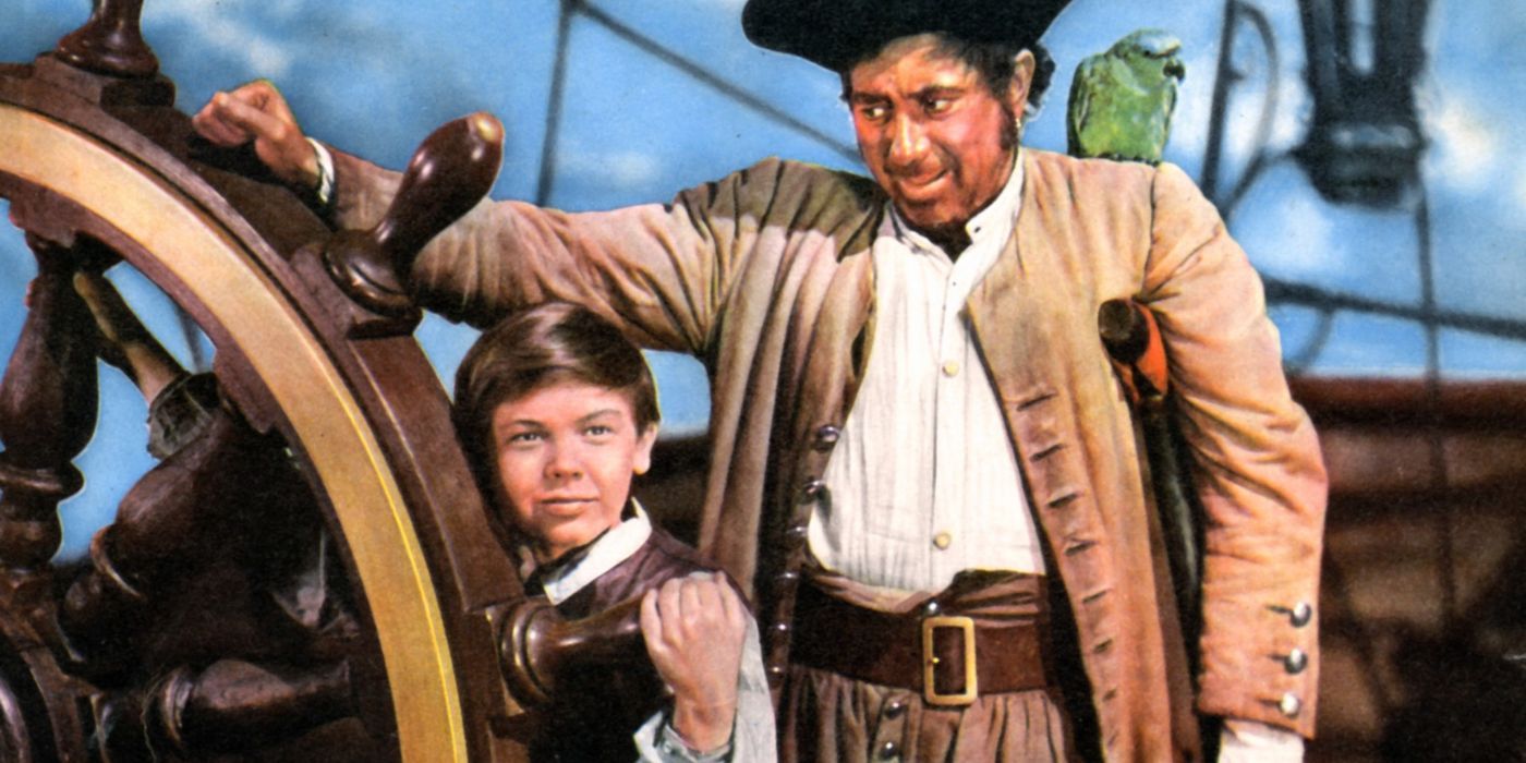 Bobby Driscoll as Jim Hawkins and Robert Newton as Long John Silver aboard a ship in Treasure Island