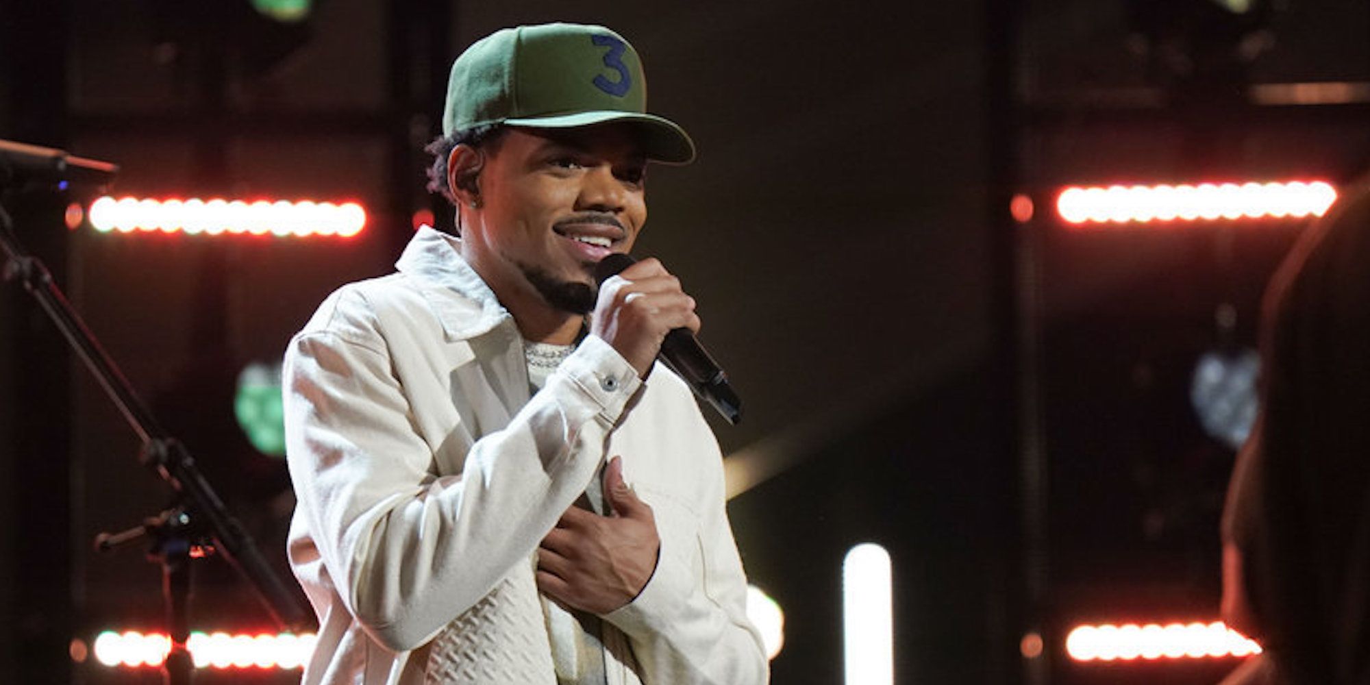 Chance the Rapper addresses the audience with a microphone in his hand on 'The Voice'