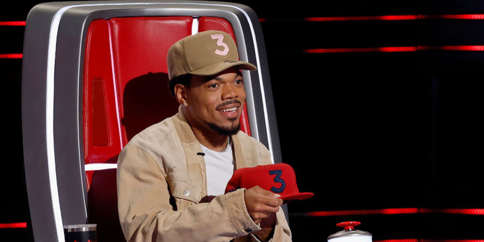 Chance the Rapper attempts to persuade a contestant on 'The Voice' with a custom "Team Chance" hat featuring his signature number 3 logo