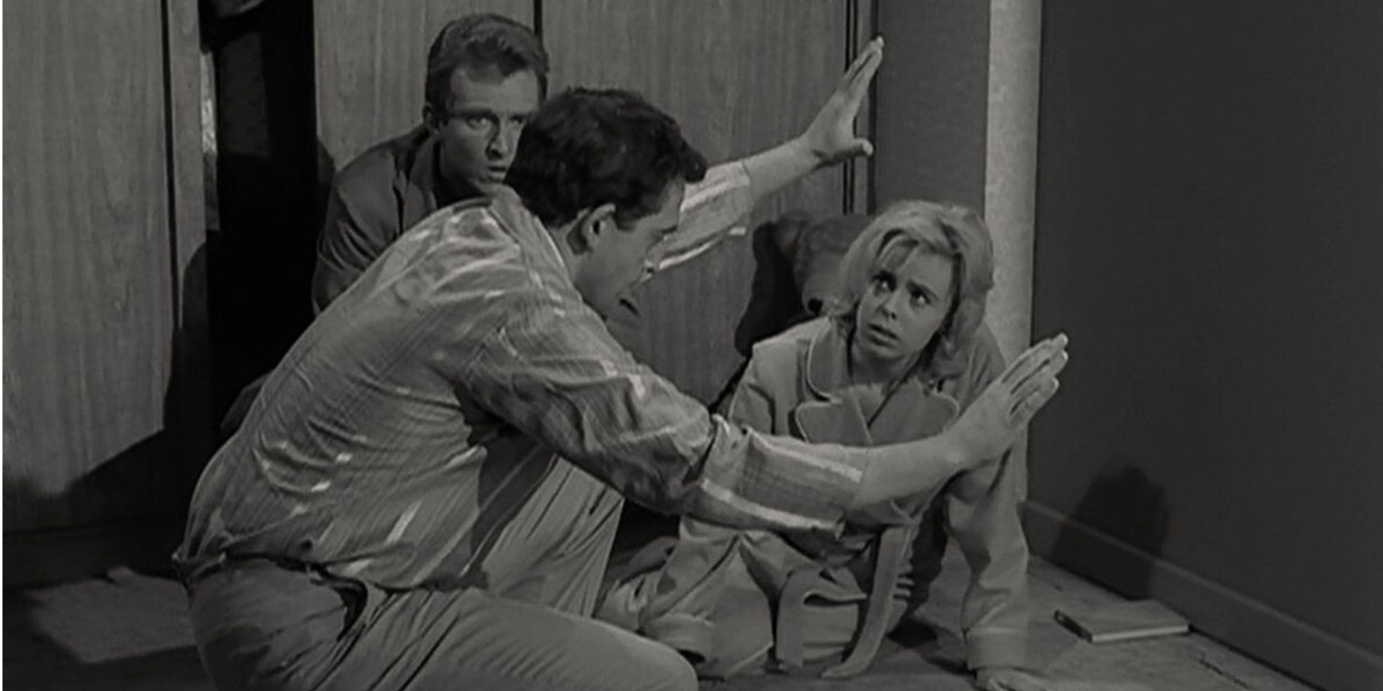 Charles Aidman, Sarah Marshall and Robert Sampson sitting in front of a wall in The Twilight Zone