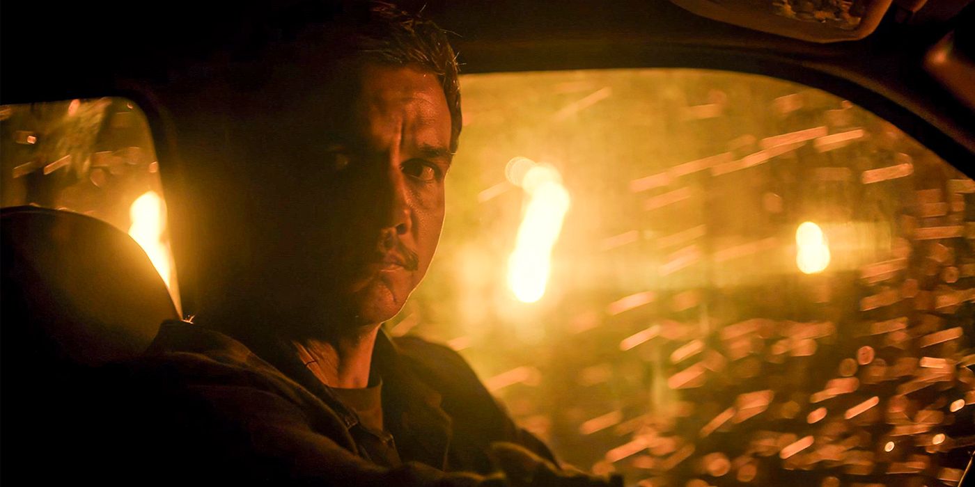Wagner Moura as Joel driving a fan through a burning forest in Civil War.