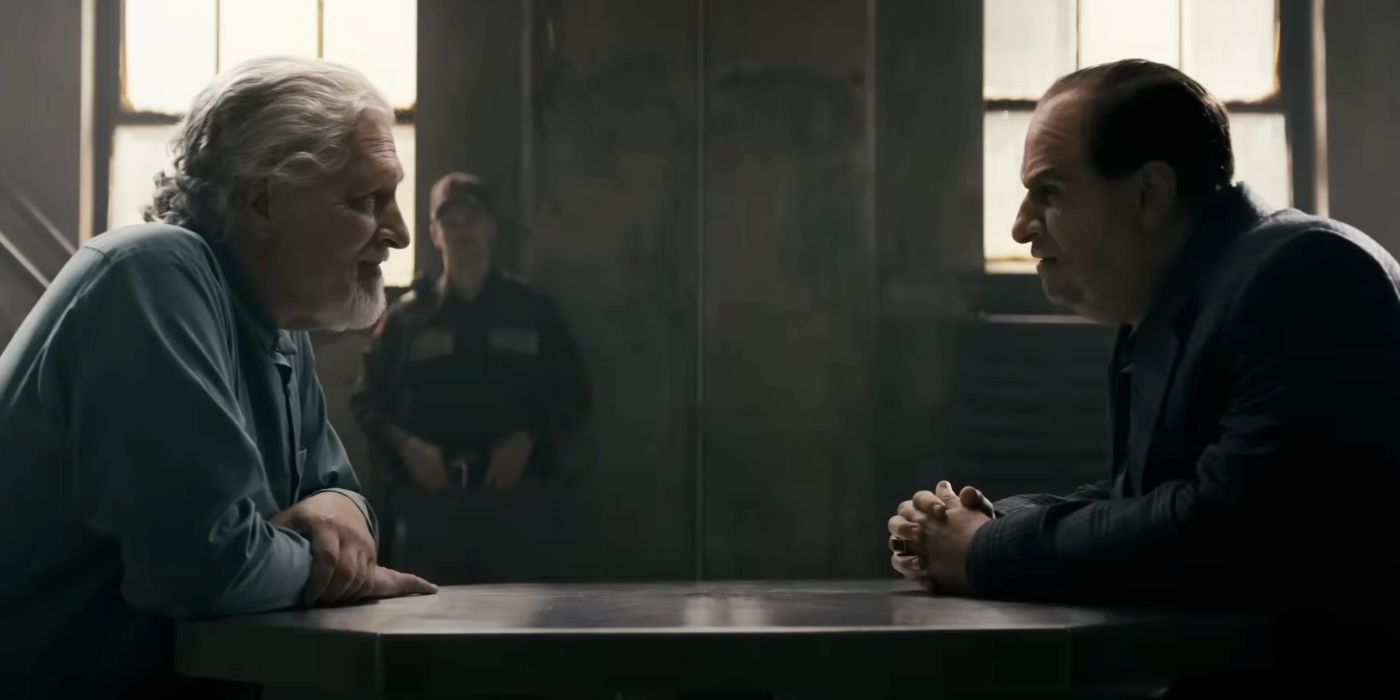 Clancy Brown and Colin Farrell talking in a prison as the Penguin and Salvatore Maroni.