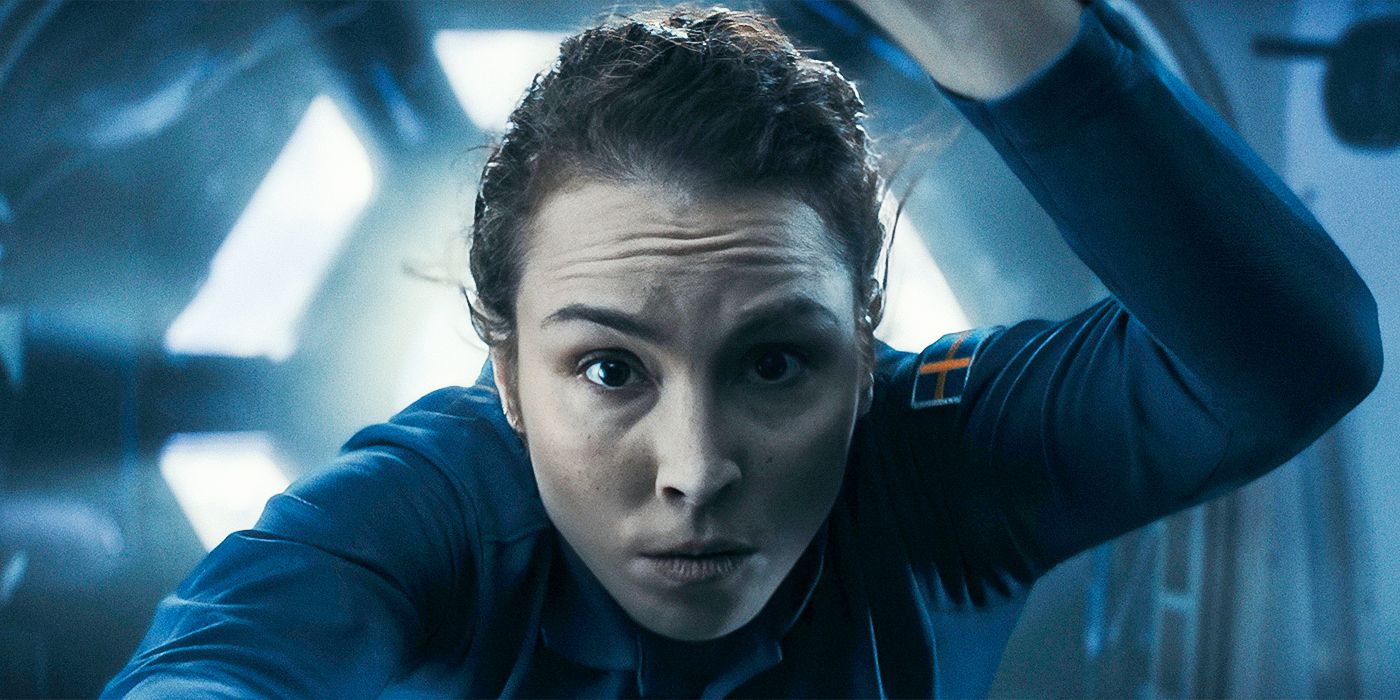 Noomi Rapace as Jo Ericsson in space looking directly at the camera in Constellation.