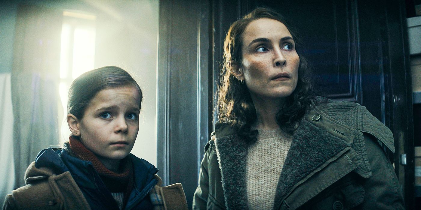 Noomi Rapace Jo Ericsson and Rosie/Davina Coleman as Alice Ericsson-Taylor look around a remote home with concern in a still from Constellation