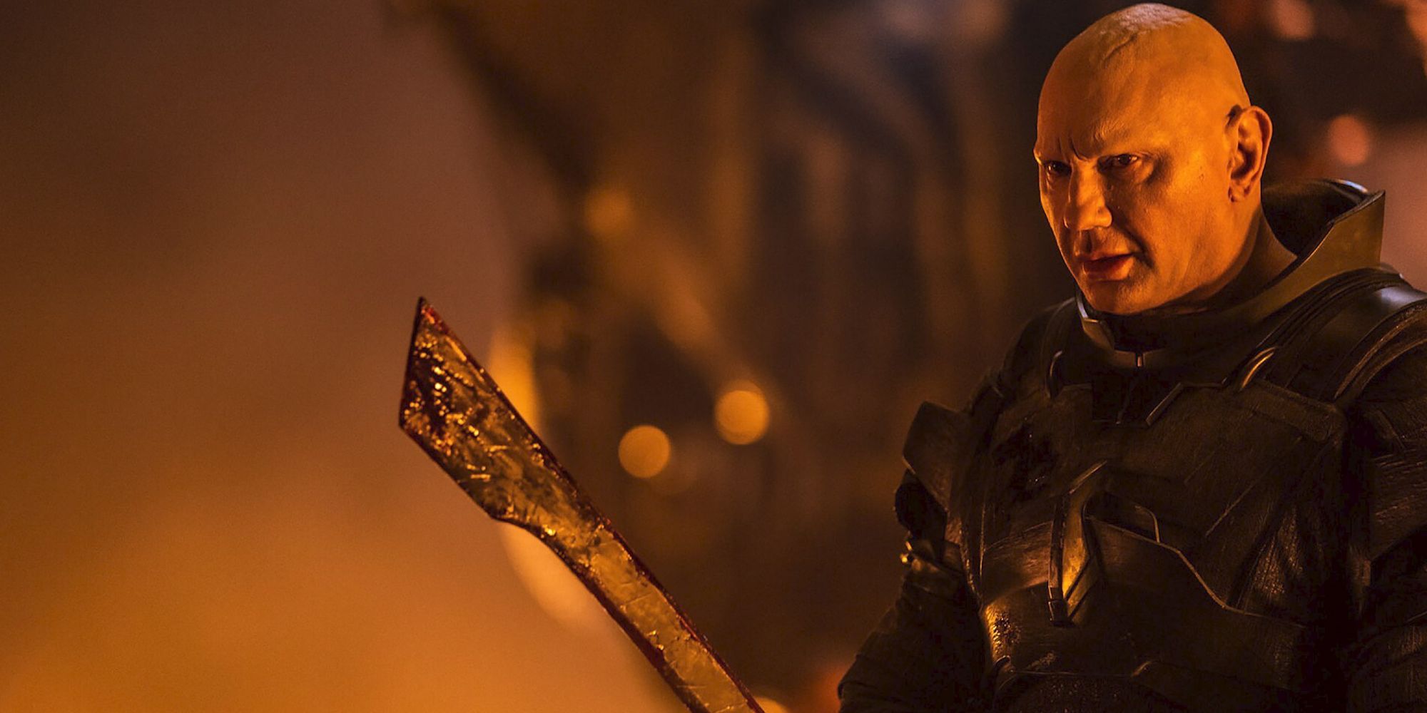 Dave Bautista as Glossu Raban holding a large blade in Dune Part Two