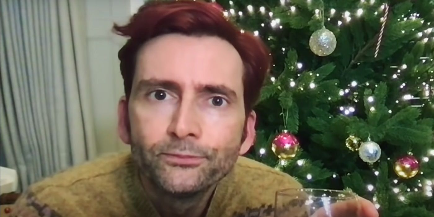 David Tennant looking at the camera with a Christmas tree behind him in Staged Season 3