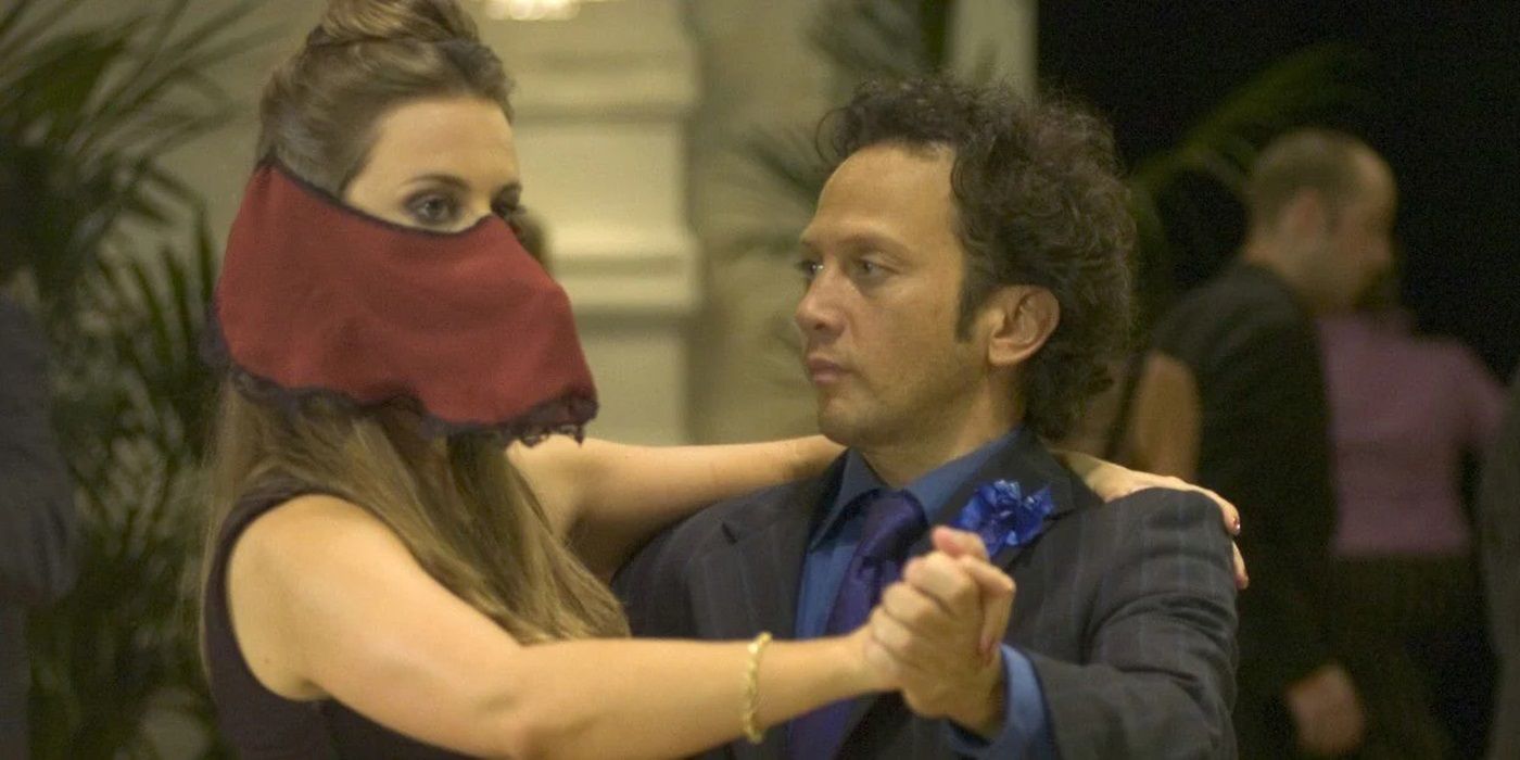 Rob Schneider as Deuce Bigalow dancing with a masked woman in Deuce Bigalow: European Gigolo