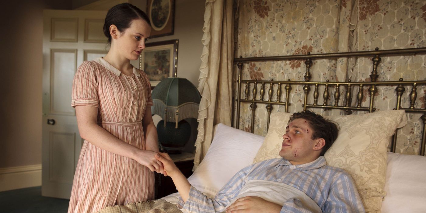 Daisy, played by Sophie McShera holding hands with William, played by Thomas Howes, in 'Downton Abbey.'