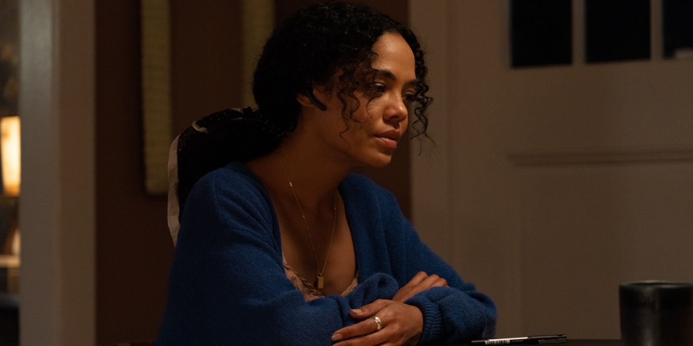 Tessa Thompson sitting down with her arms crossed in The Listener.