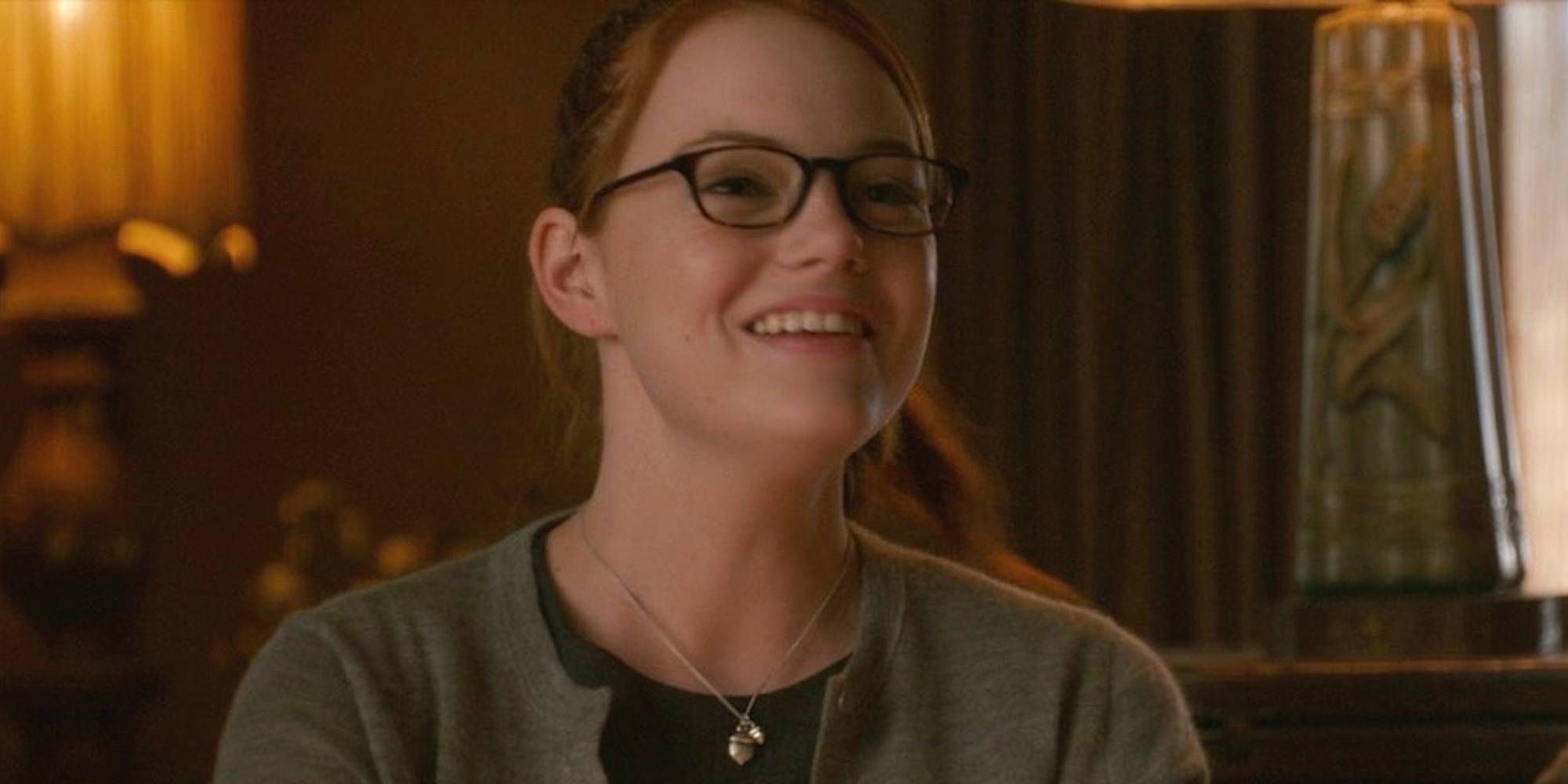 Emma Stone in The House Bunny smiling with eyeglasses on.