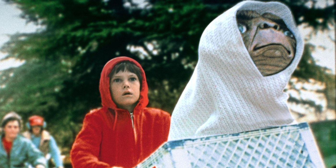 Henry Thomas as Elliott with E.T. in his bicycle basket in 'E.T. the Extra-Terrestrial'.