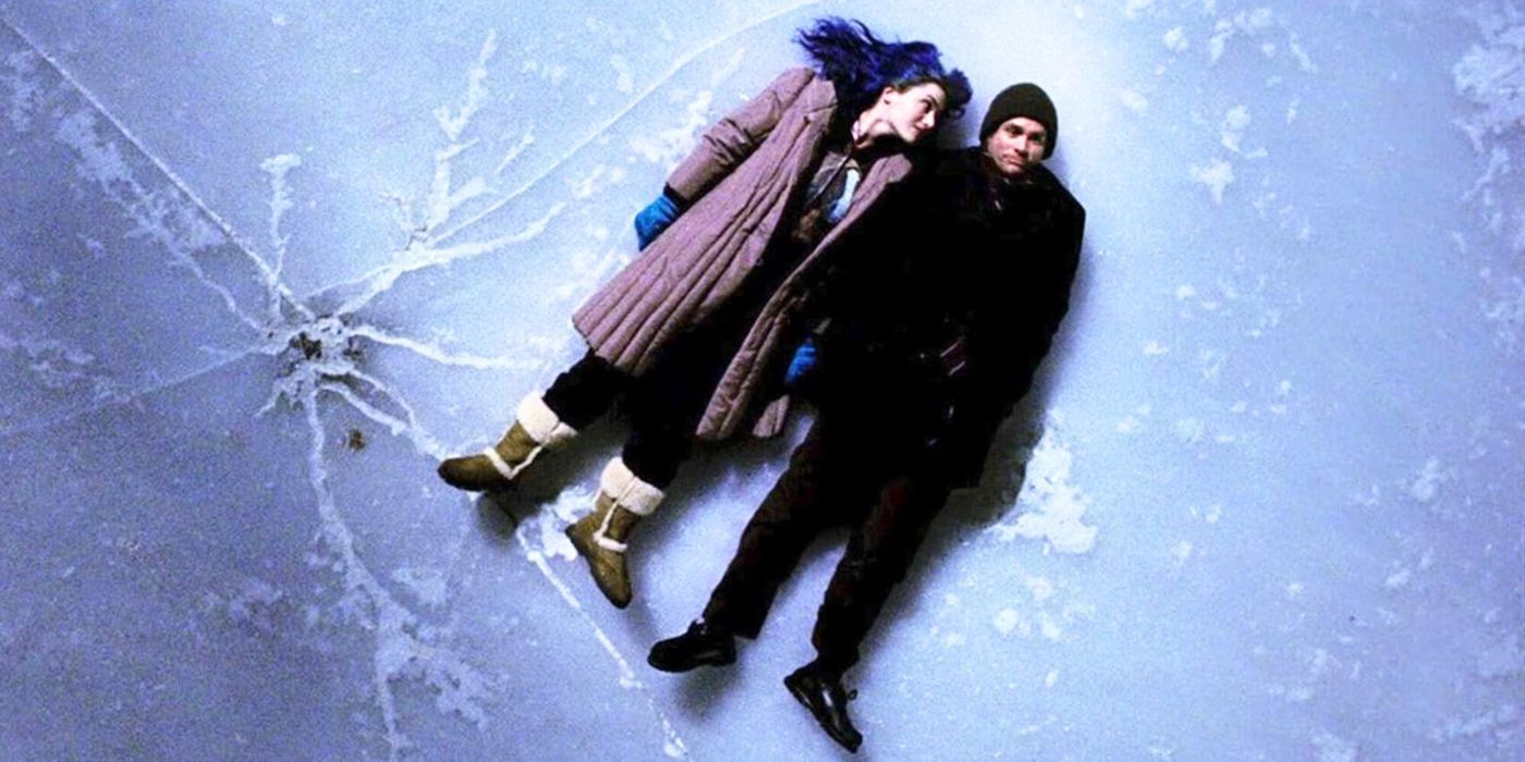 Jim Carrey as Joel and Kate Winslet as Clementine laying in the snow in Eternal Sunshine of a Spotless Mind