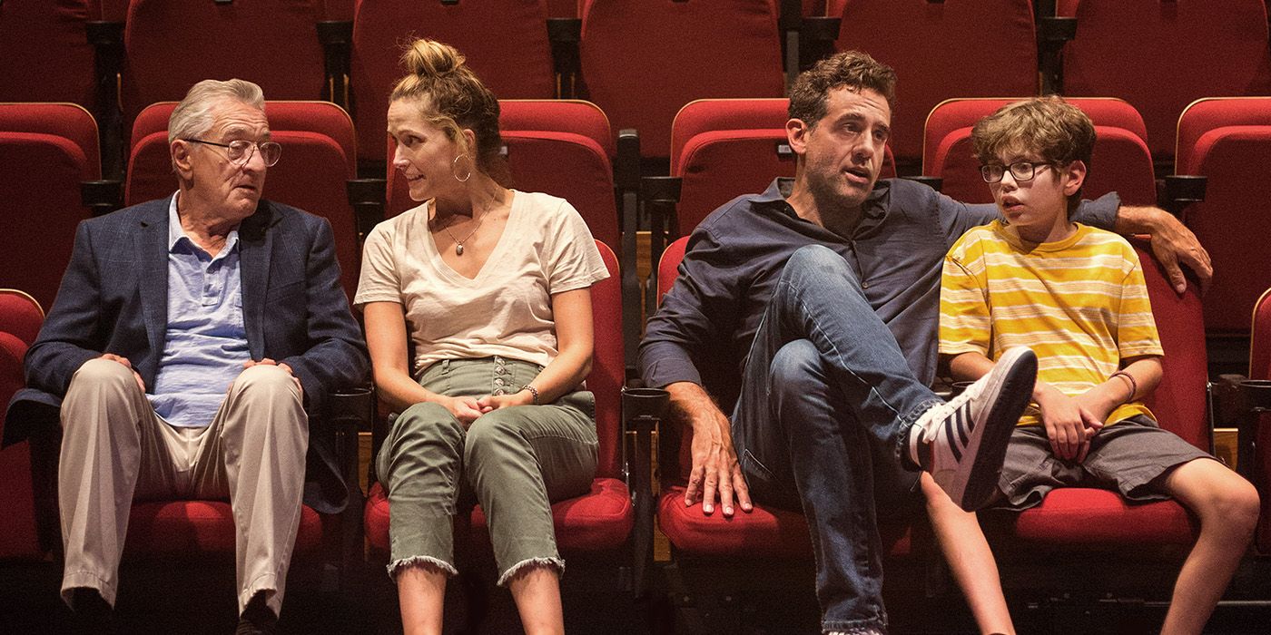 Robert De Niro, Rose Byrne, Bobby Cannavale, and William Fitzgerald sitting in a movie theater in Ezra