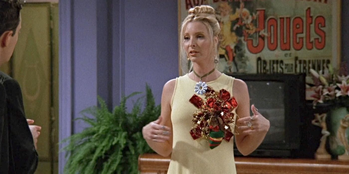 Lisa Kudrow as Phoebe Buffay, wearing a yellow dress with a large bow on the front of it in the Friends episode "The One Where No One's Ready"