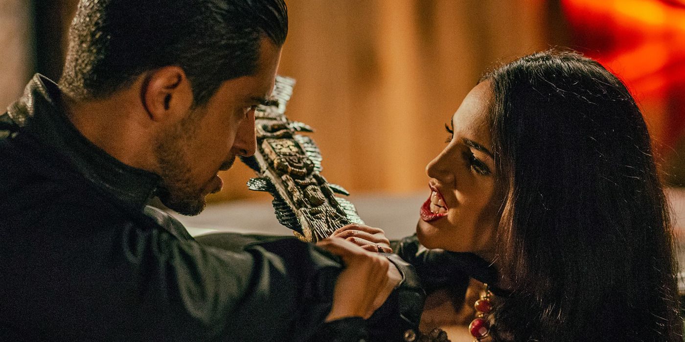 Kisa (Eiza González) barring her teeth at Carlos Madrigal (Wilmer Valderrama) in From Dusk till Dawn: The Series