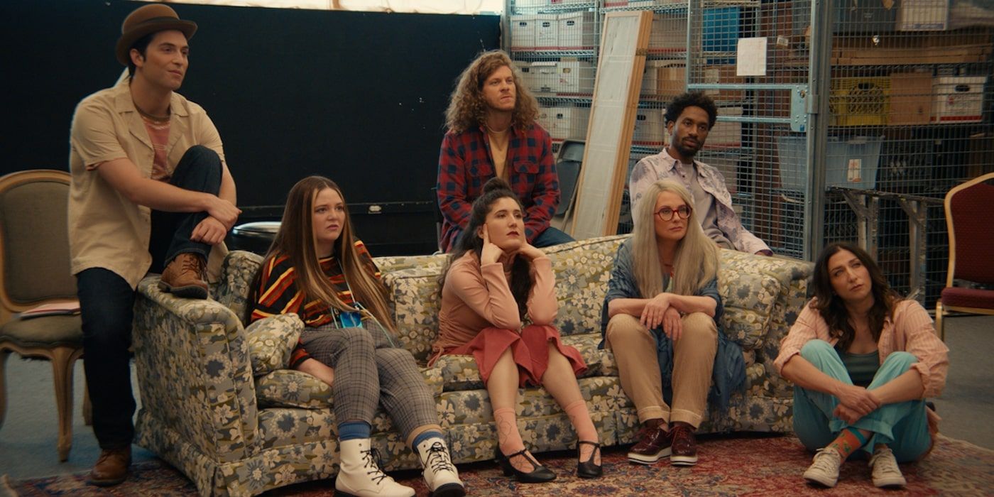 Benito Skinner, Meg Stalter, Kate Berlant, Megan Mullally, Blake Anderson, Chelsea Peretti, and Jak Knight sitting on couch in First Time Female Director