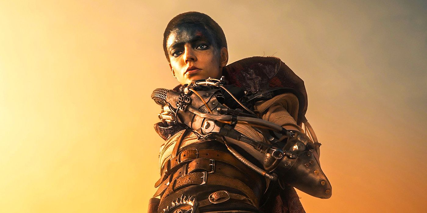 Anya Taylor Joy with black paint on her forehead and a robot arm in Furiosa: A Mad Max Saga