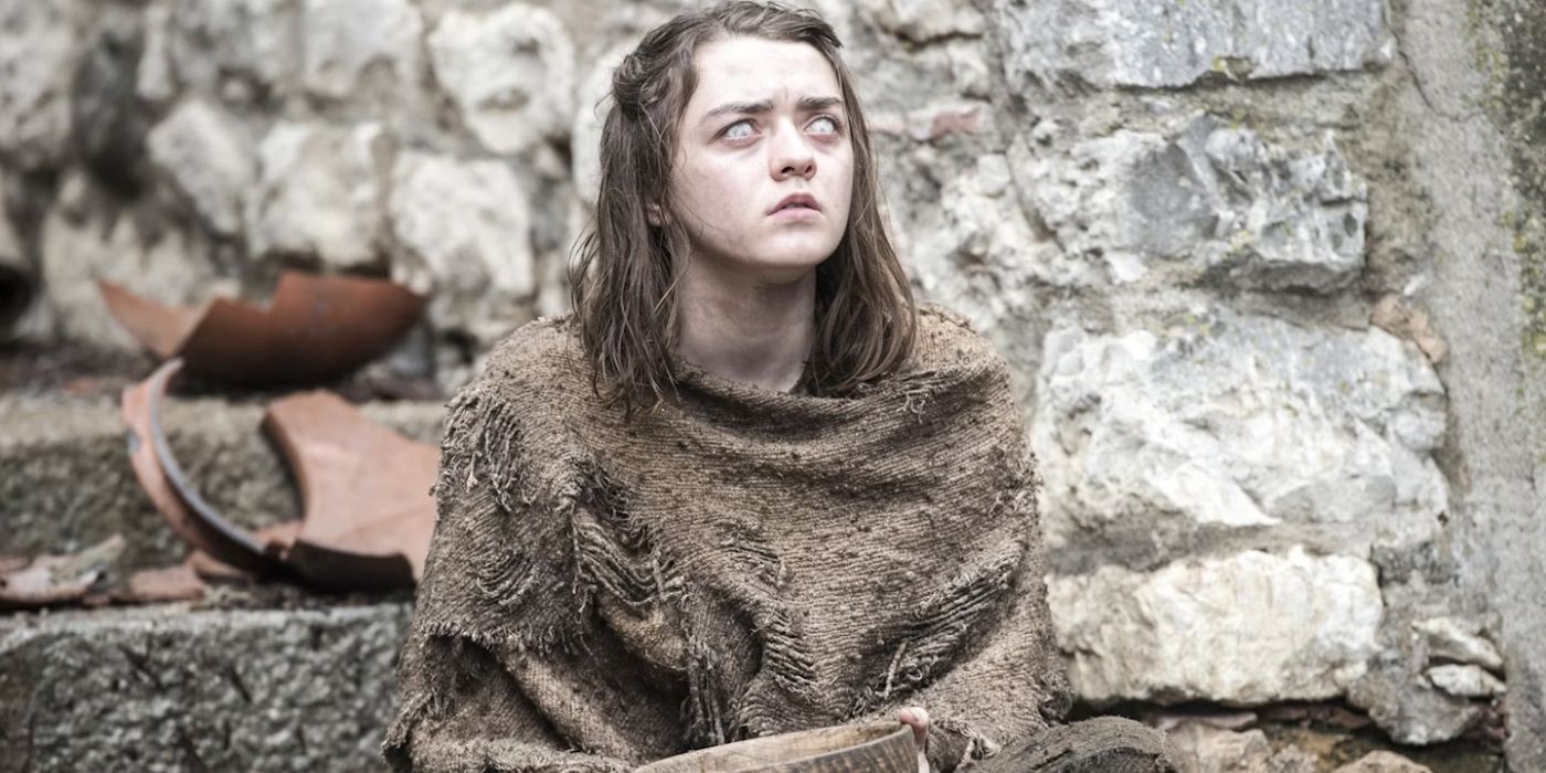 Arya Stark (Maisie Williams) sits blinded on the steps of Braavos, living as a begger.