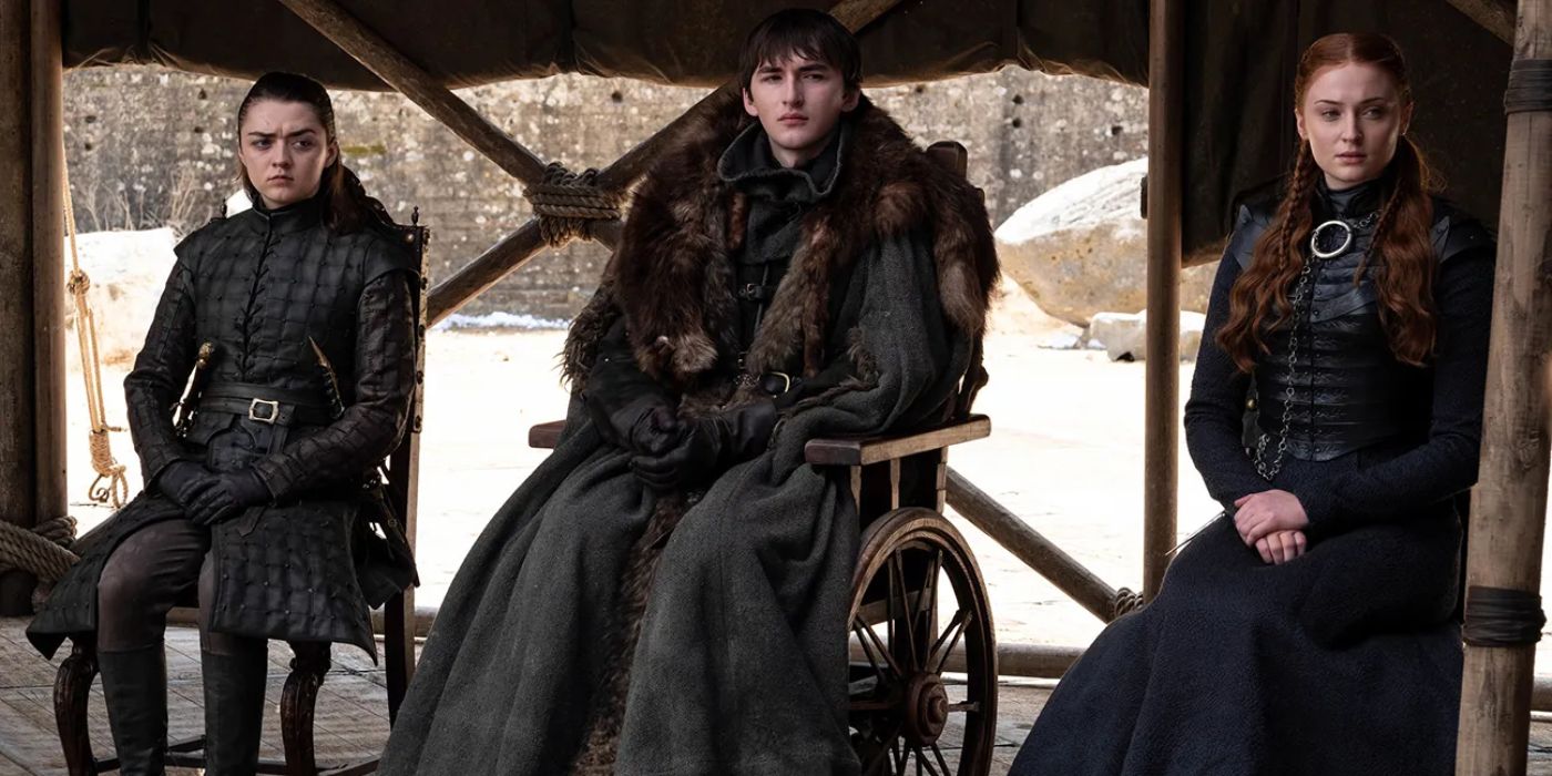 Arya Stark (Maisie Williams) and Sansa Stark (Sophie Turner) sit alongside their brother Bran (Isaac Hempstead-Wright) who is to be crowned king of the seven kingdoms.