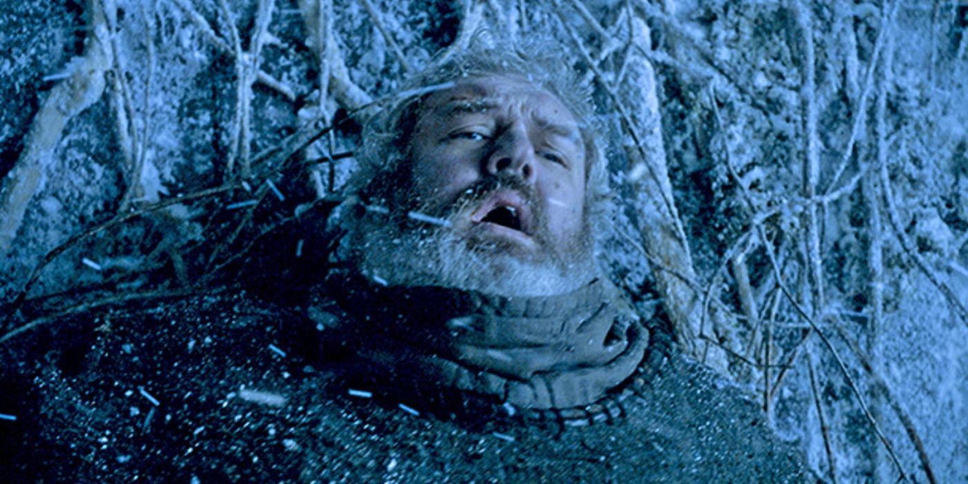 Hodor (Kristian Nairn) stands in the freezing snow, holding back the door so that his friends can escape the wights.