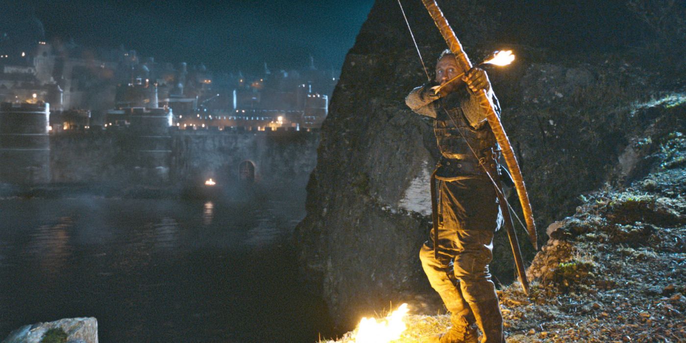 Bronn (Jerome Flynn) pulls his bow with a fire-tipped arrow that he aims at the blackwater bay.