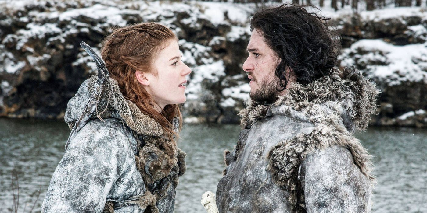 Ygritte (Rose Leslie) antagonizes Jon Snow (Kit Harrington) as they both stand by a freezing lake in Wildling furs.