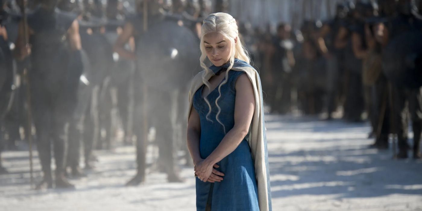 Daenerys Targaryen (Emilia Clarke) stands on the sands before her mighty army who ride on horseback.