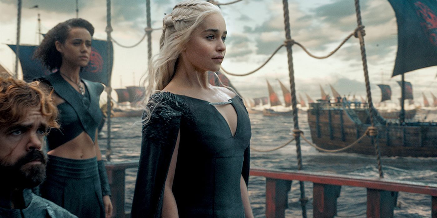 Daenerys Targaryen (Emilia Clarke) stands tall on a ship with her advisors as she and her armies set sail for Westeros.