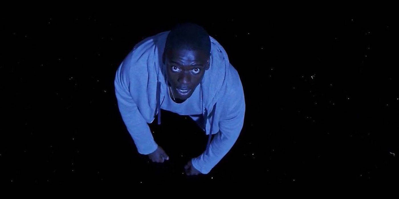 Chris Washington looking upward in the Sunken Place in Get Out