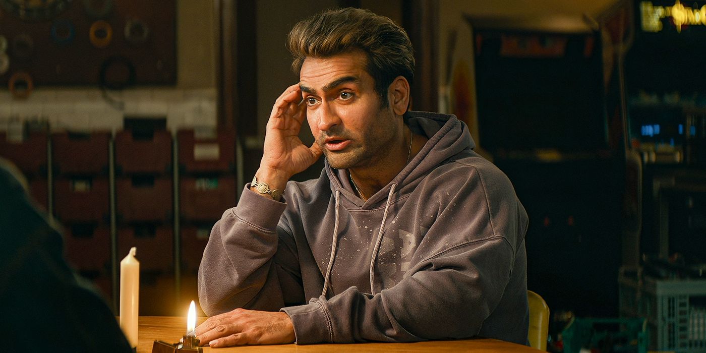 Kumail Nanjiani sitting at a table looking perplexed in Ghostbusters: Frozen Empire