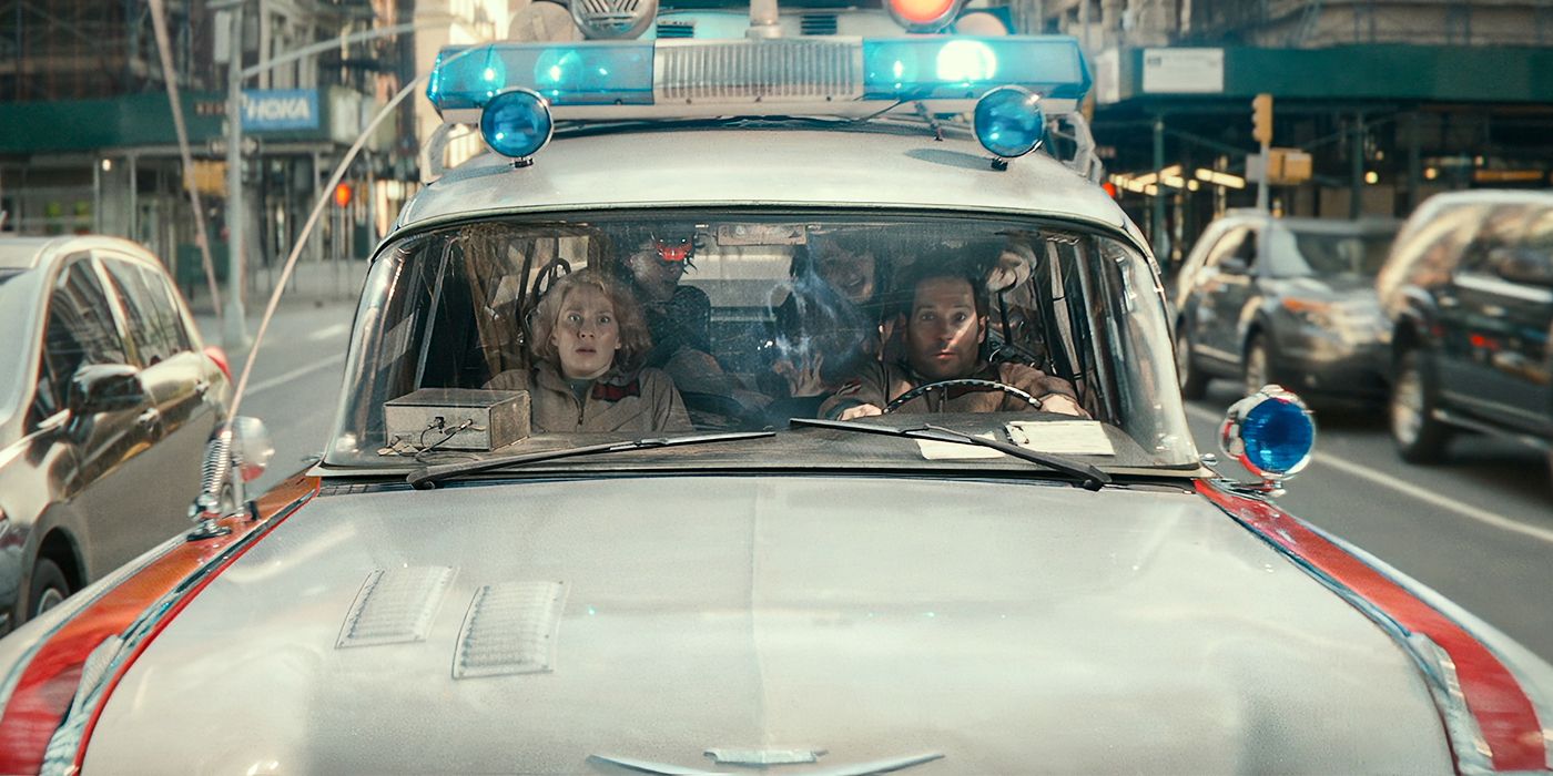 Carrie Coon, Paul Rudd, Finn Wolfhard, and Mckenna Grace in the Ecto-1 in Ghostbusters: Frozen Empire